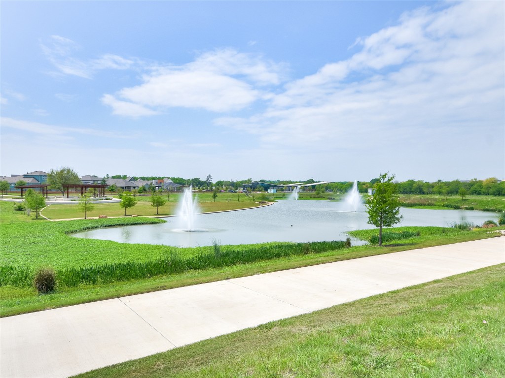 7401 Grand Linden Way, Unit 78 Austin, TX 78744 - Photo 15 of 17 a view of a lake with a big yard