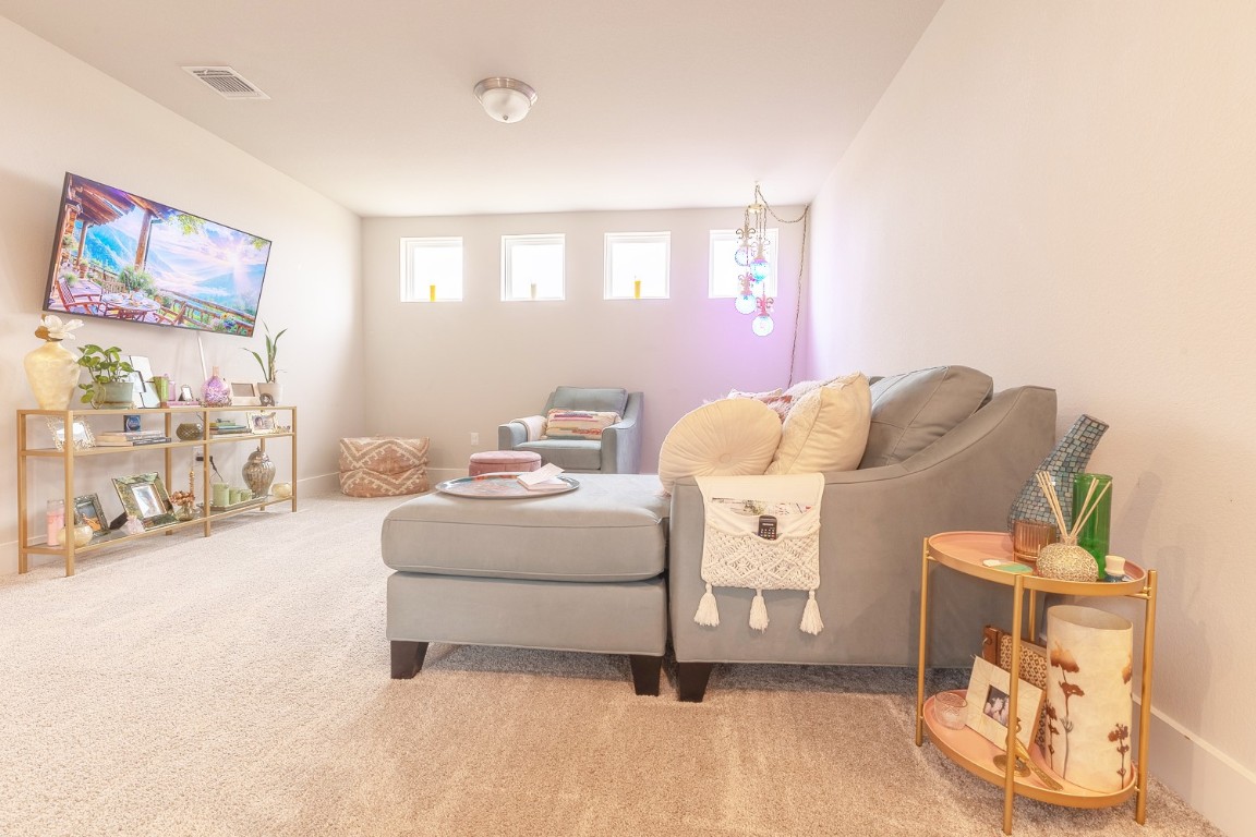 7401 Grand Linden Way, Unit 78 Austin, TX 78744 - Photo 5 of 17 a living room with furniture and a window
