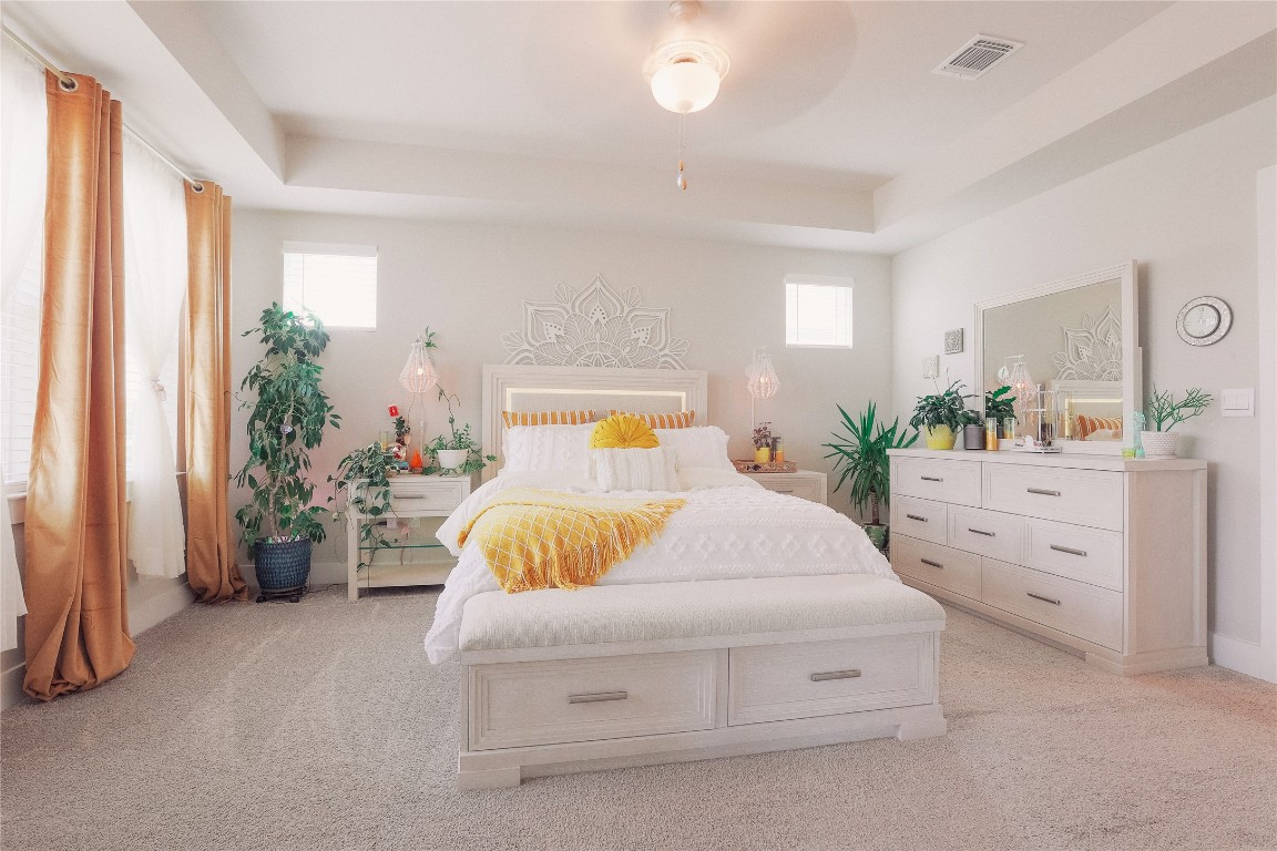 7401 Grand Linden Way, Unit 78 Austin, TX 78744 - Photo 6 of 17 a bedroom with a bed and a dresser