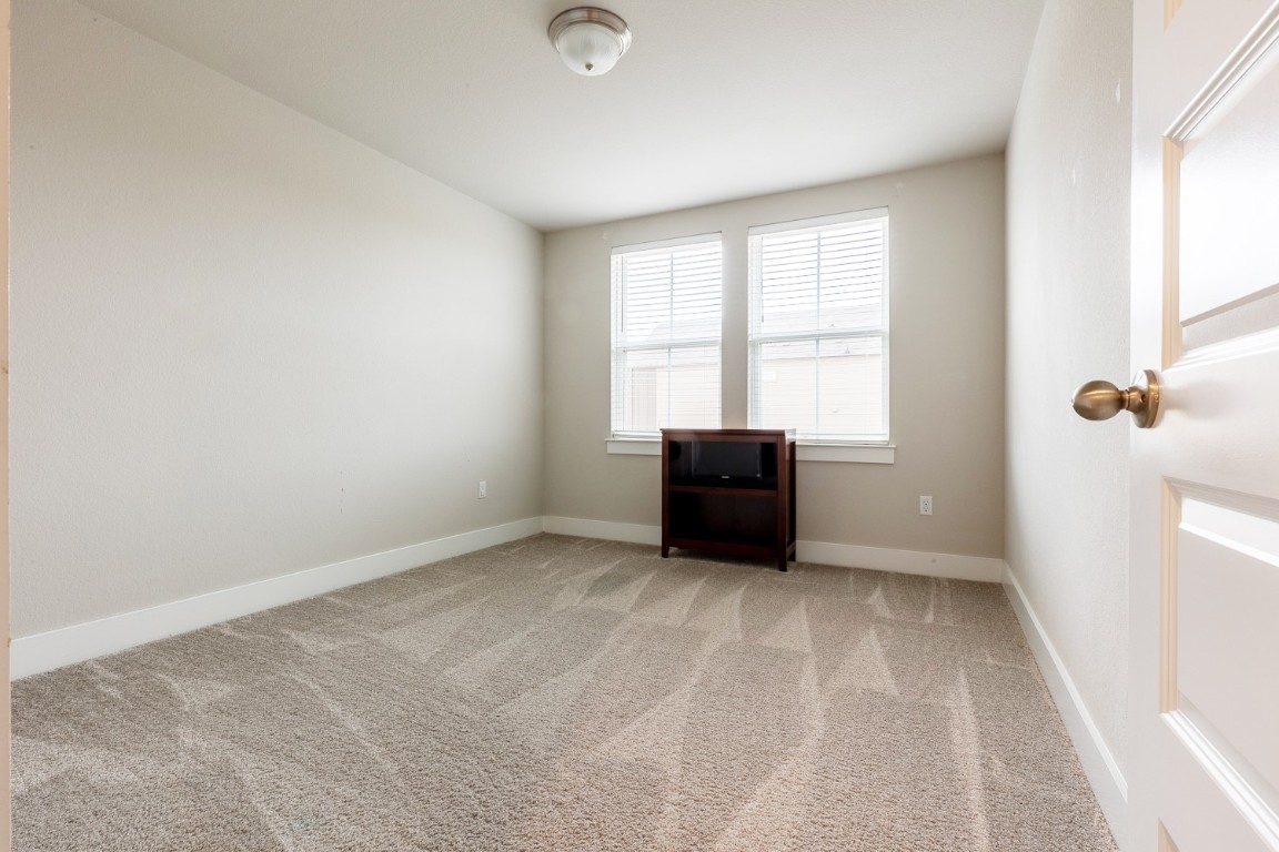 7401 Grand Linden Way, Unit 78 Austin, TX 78744 - Photo 10 of 17 a view of an empty room with a window