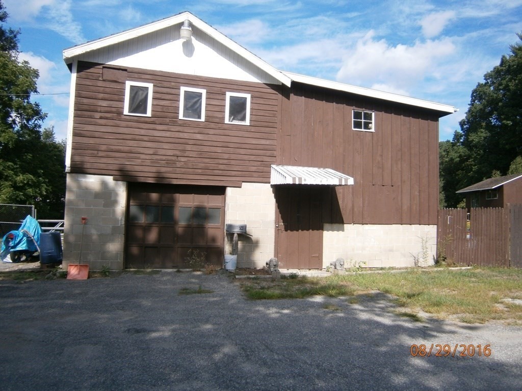 1513 Broadway Haverhill, MA 01832 - Photo 3 of 9 a front view of a house with a yard