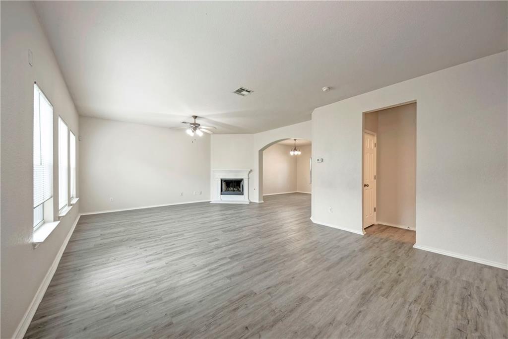 1962 Rachel Lane Round Rock, TX 78664 - Photo 4 of 22 wooden floor in an empty room with a window