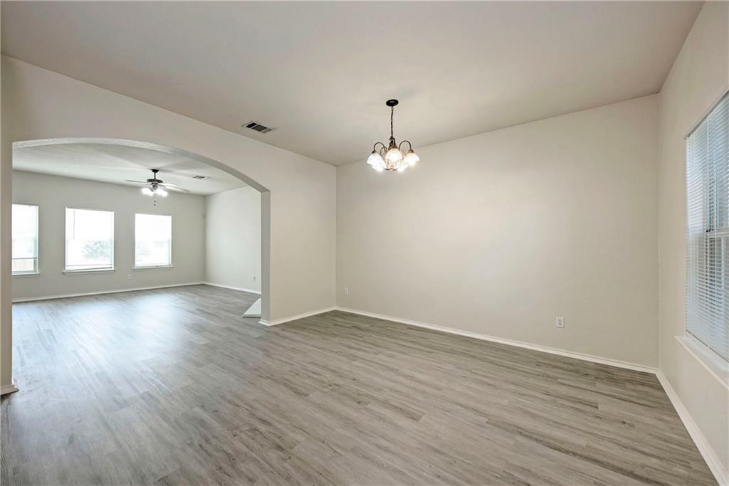 1962 Rachel Lane Round Rock, TX 78664 - Photo 6 of 22 wooden floor in an empty room with a window