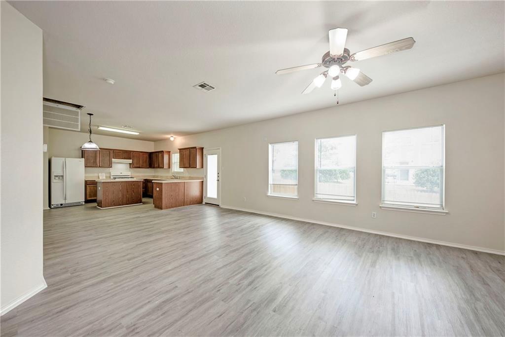 1962 Rachel Lane Round Rock, TX 78664 - Photo 9 of 22 a view of a livingroom with a kitchen counter tops and wooden floor