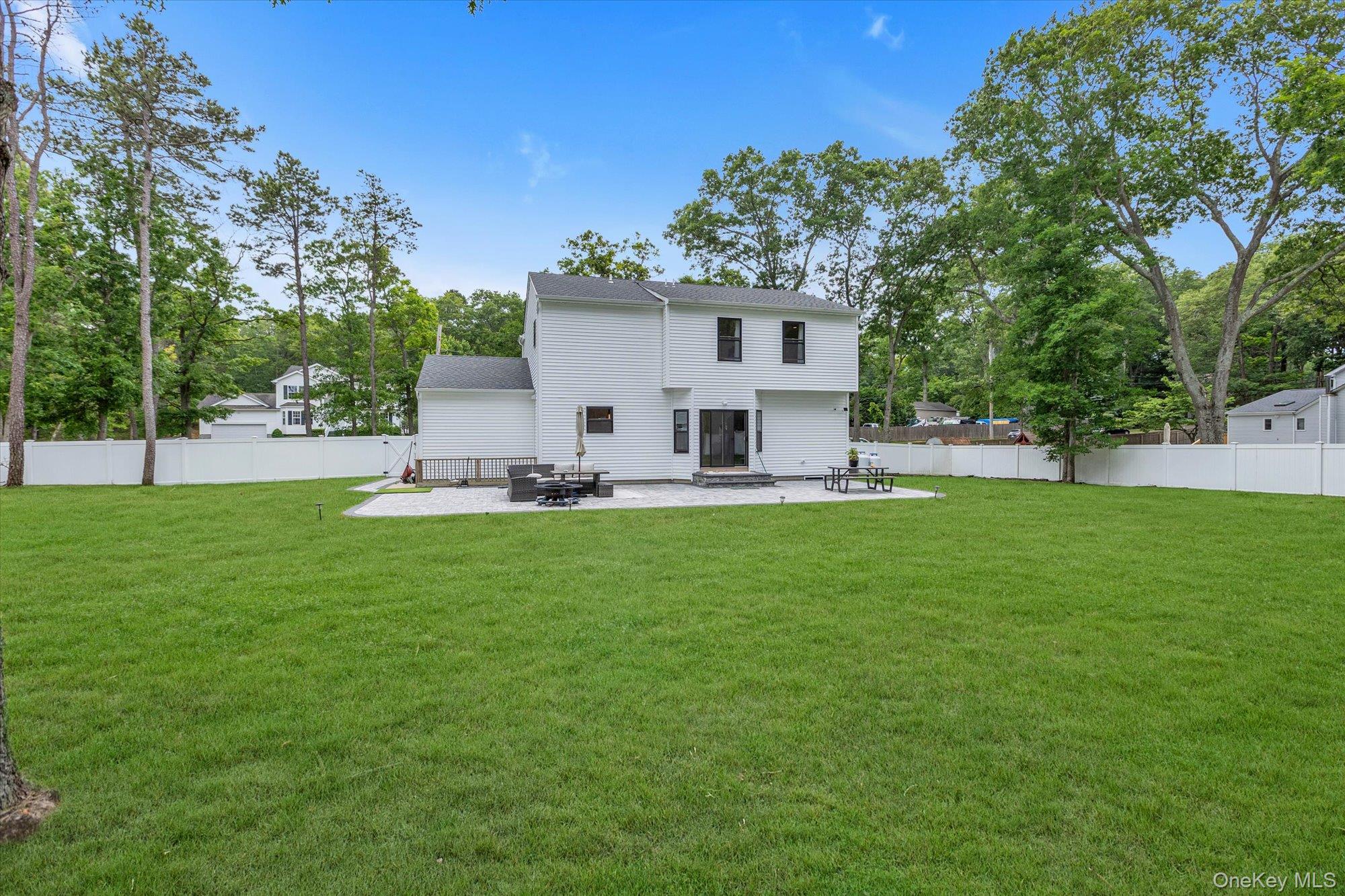 135 Elizabeth Way Ridge, NY 11961 - Photo 21 of 24 a view of house with backyard