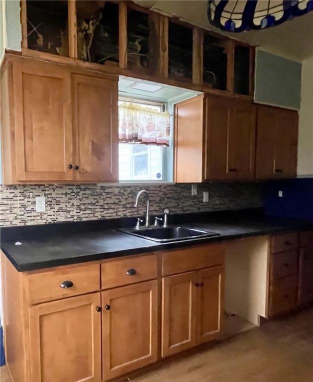424 Ridge Avenue New Kensington, PA 15068 - Photo 5 of 15 a kitchen with granite countertop white cabinets and sink
