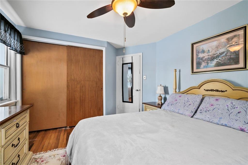 6617 Landview Road Pittsburgh, PA 15217 - Photo 12 of 23 a bedroom with a bed and a painting on the wall