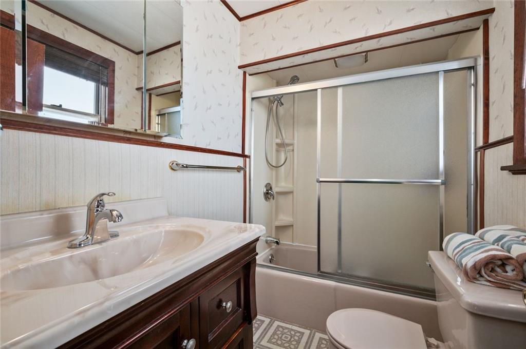 6617 Landview Road Pittsburgh, PA 15217 - Photo 14 of 23 a bathroom with a sink a toilet and shower