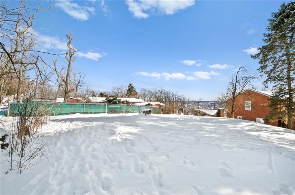6617 Landview Road Pittsburgh, PA 15217 - Photo 22 of 23 a view of a house with a yard and garage