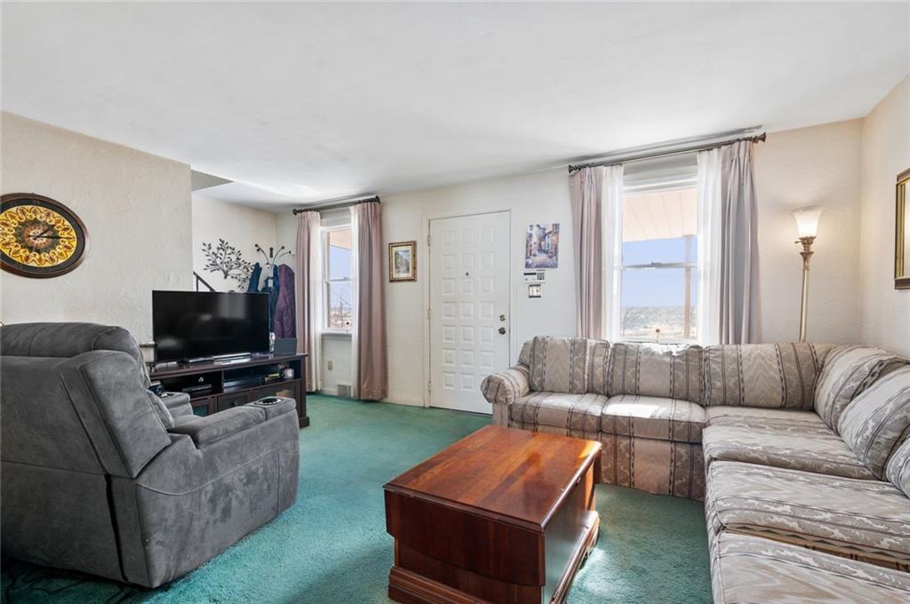 6617 Landview Road Pittsburgh, PA 15217 - Photo 3 of 23 a living room with furniture and a flat screen tv