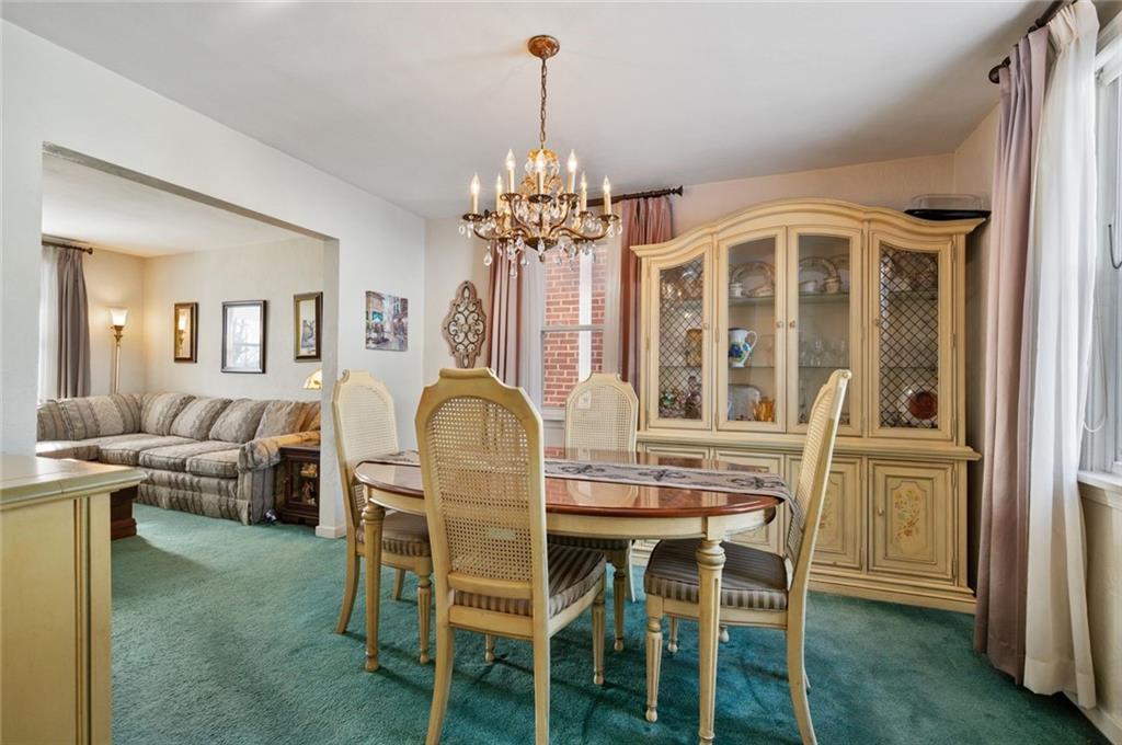 6617 Landview Road Pittsburgh, PA 15217 - Photo 6 of 23 a view of a dining room with furniture and chandelier