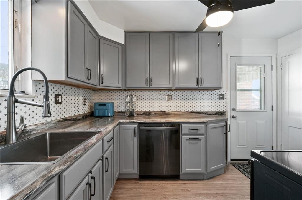 6617 Landview Road Pittsburgh, PA 15217 - Photo 9 of 23 a kitchen with stainless steel appliances granite countertop a sink stove and cabinets