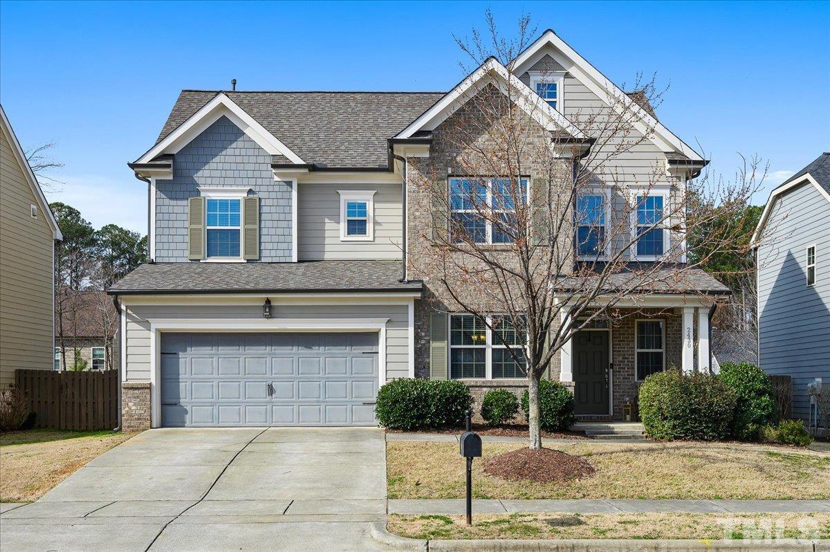 2430 Pilsley Road Apex, NC 27539 - Photo 1 of 3 a front view of a house with garden