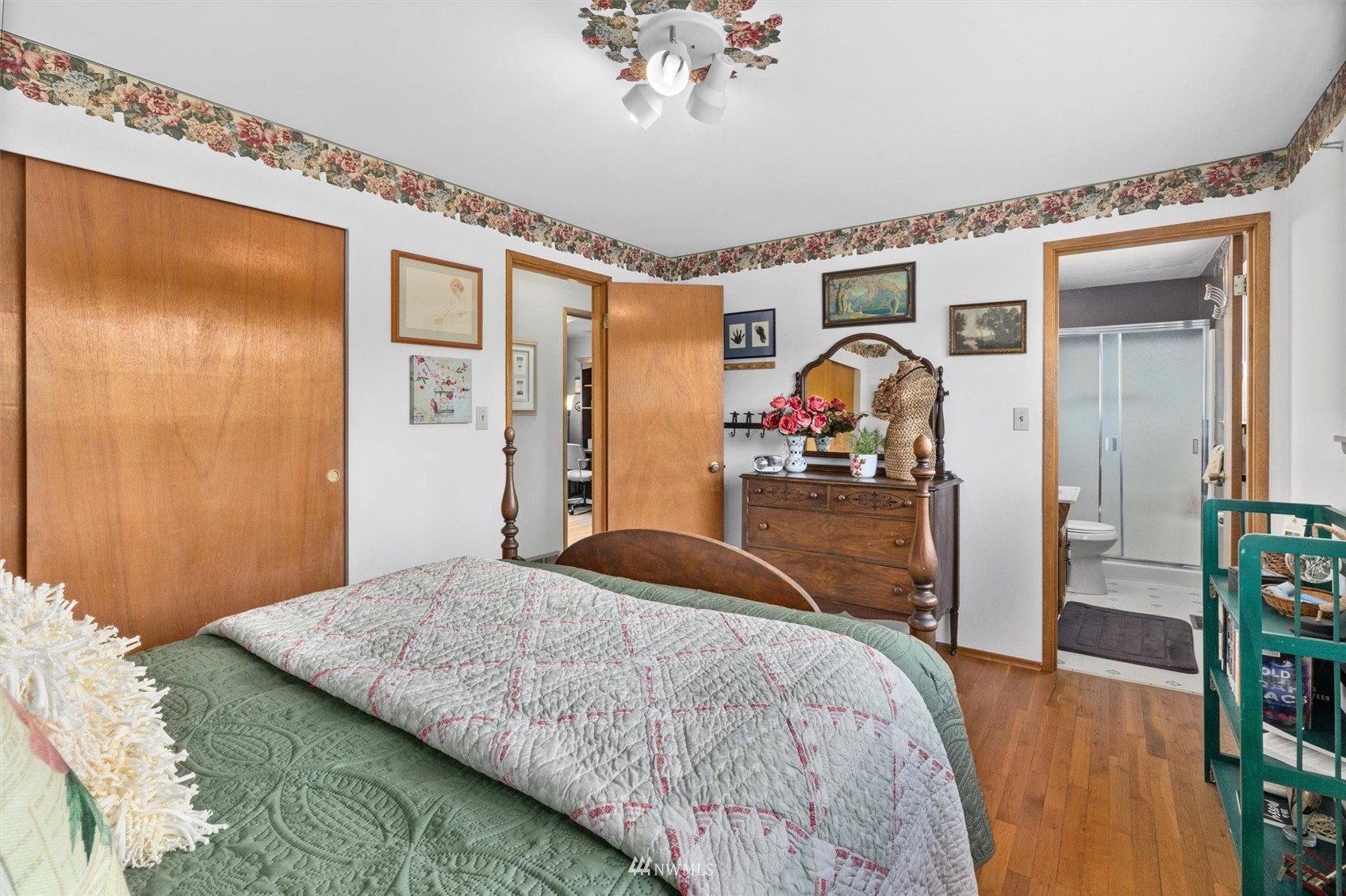 1005 Cascade Drive Edmonds, WA 98020 - Photo 14 of 22 a bedroom with a bed and a large mirror with a flat tv screen
