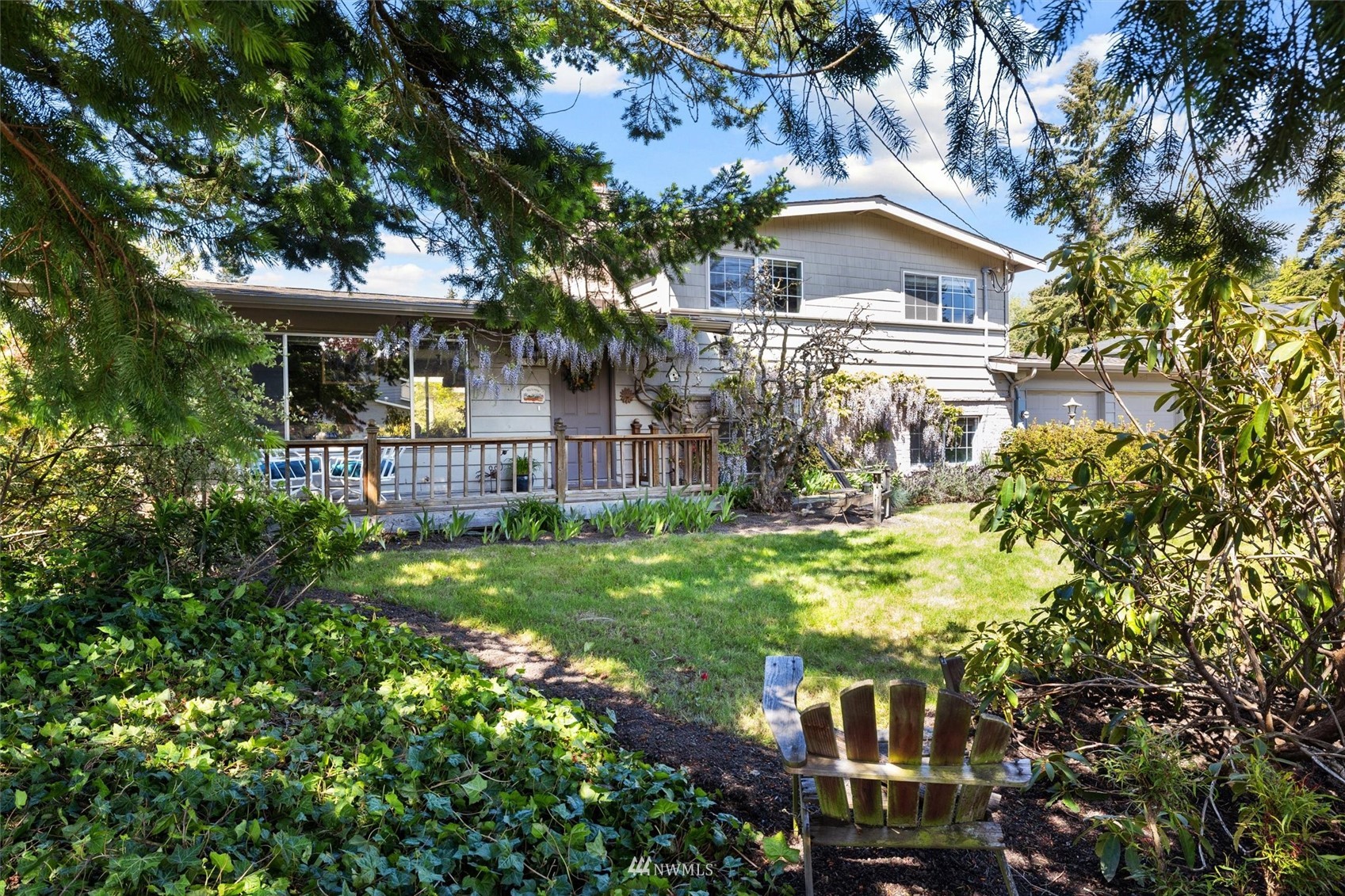 1005 Cascade Drive Edmonds, WA 98020 - Photo 5 of 22 a view of a house with a yard and a tree