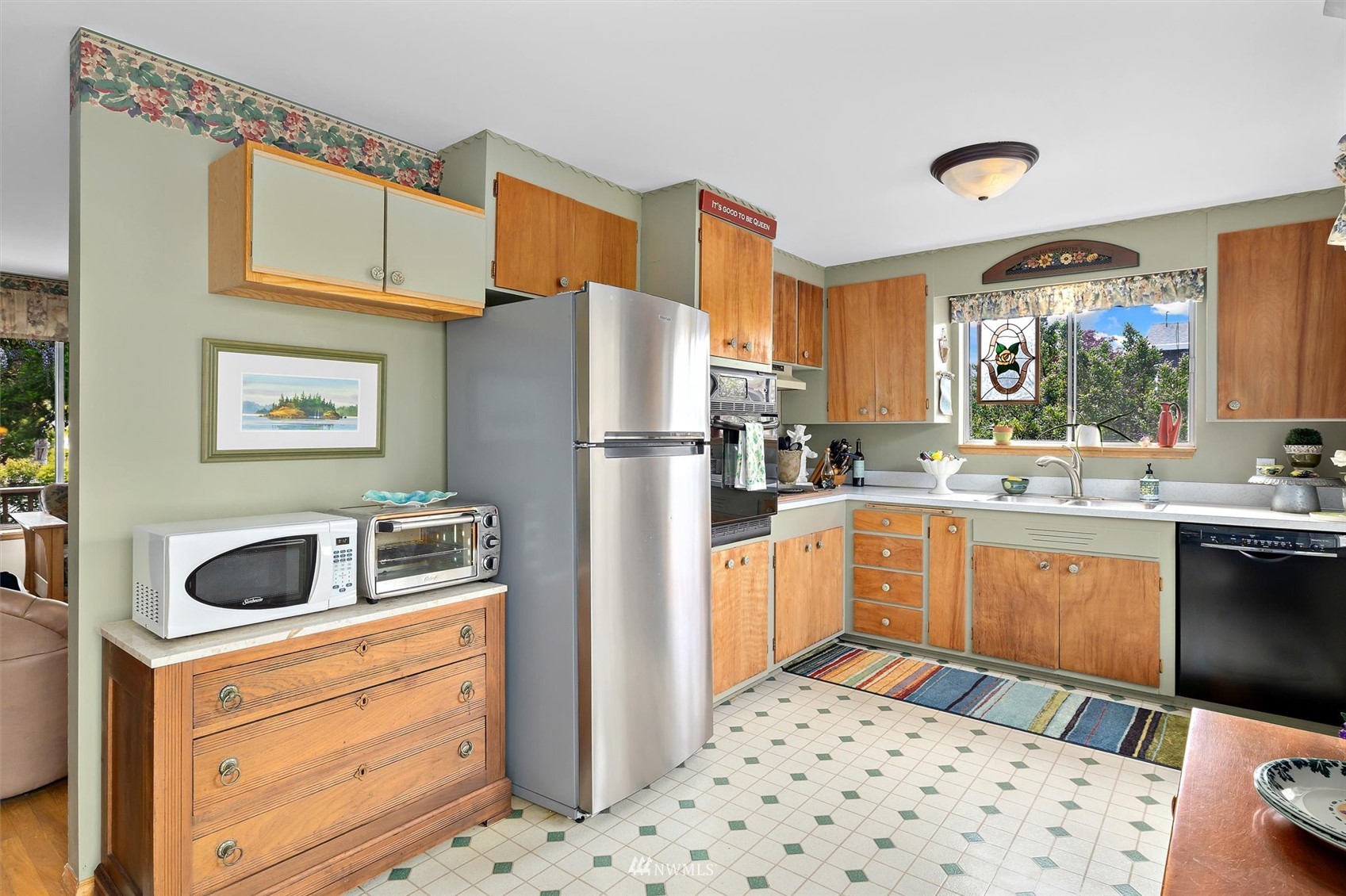 1005 Cascade Drive Edmonds, WA 98020 - Photo 10 of 22 a kitchen with a refrigerator and cabinets
