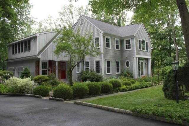 150 Branchville Road Ridgefield, CT 06877 - Photo 1 of 1 a front view of a house with a garden