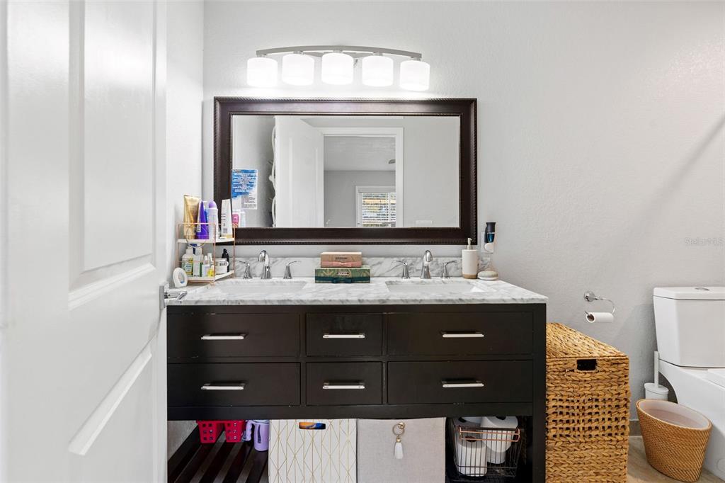 2453 Roberta Street Largo, FL 33771 - Photo 16 of 29 a bathroom with a sink vanity and a mirror