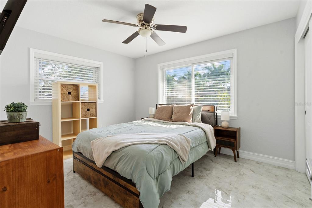 2453 Roberta Street Largo, FL 33771 - Photo 19 of 29 a bedroom with a bed and a window