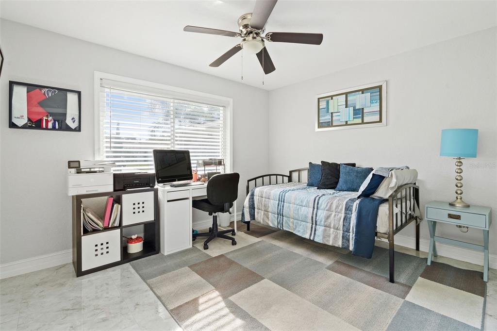 2453 Roberta Street Largo, FL 33771 - Photo 22 of 29 a livingroom with a workspace