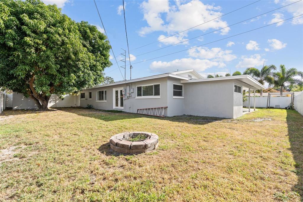 2453 Roberta Street Largo, FL 33771 - Photo 23 of 28 a view of a house with backyard and sitting area