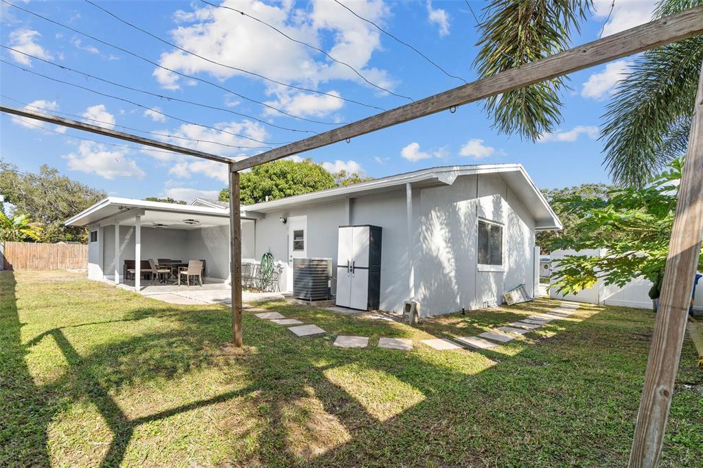 2453 Roberta Street Largo, FL 33771 - Photo 25 of 29 a view of a house with a yard