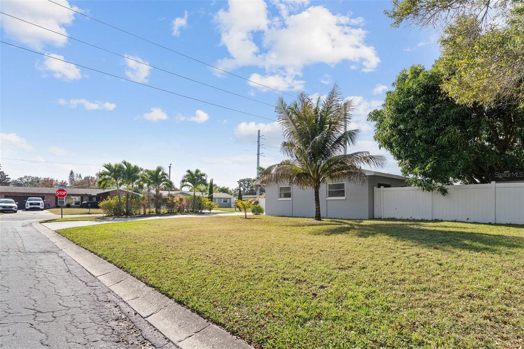 2453 Roberta Street Largo, FL 33771 - Photo 26 of 28 a front view of a house with a yard