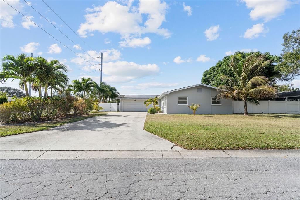 2453 Roberta Street Largo, FL 33771 - Photo 28 of 28 a front view of a house with garden
