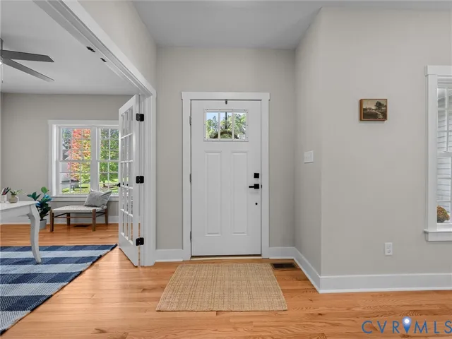 a view of a dining room with furniture wooden floor and a rug