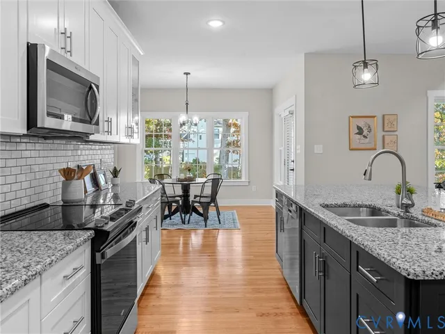 a large kitchen with lots of counter space and windows