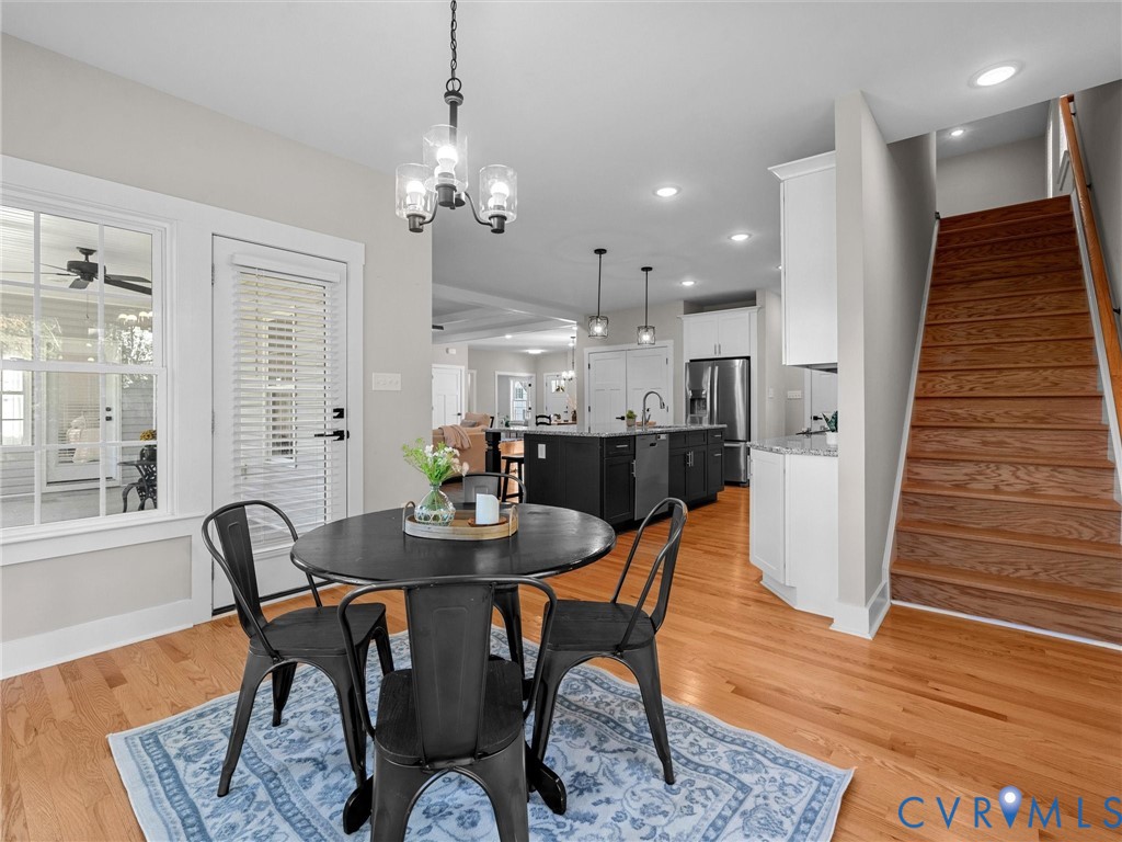 9018 Mahogany Drive Chesterfield, VA 23832 - Photo 25 of 49 Dining area with stairway, light wood-style floori