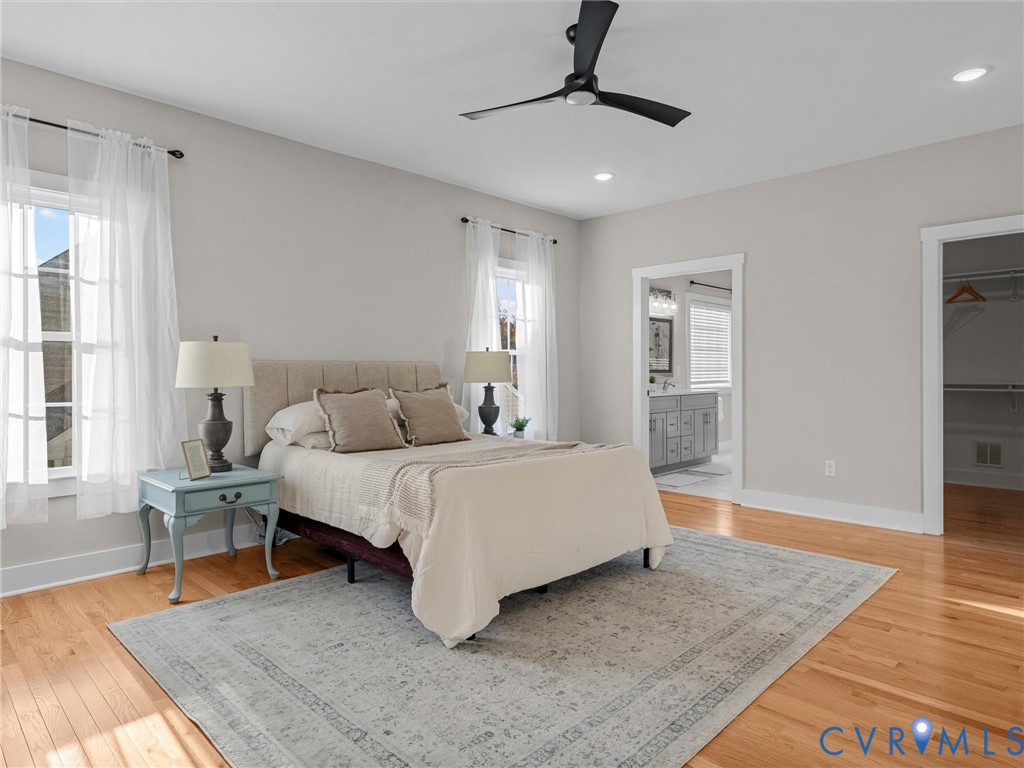 9018 Mahogany Drive Chesterfield, VA 23832 - Photo 27 of 49 Bedroom featuring a walk in closet, light wood-typ