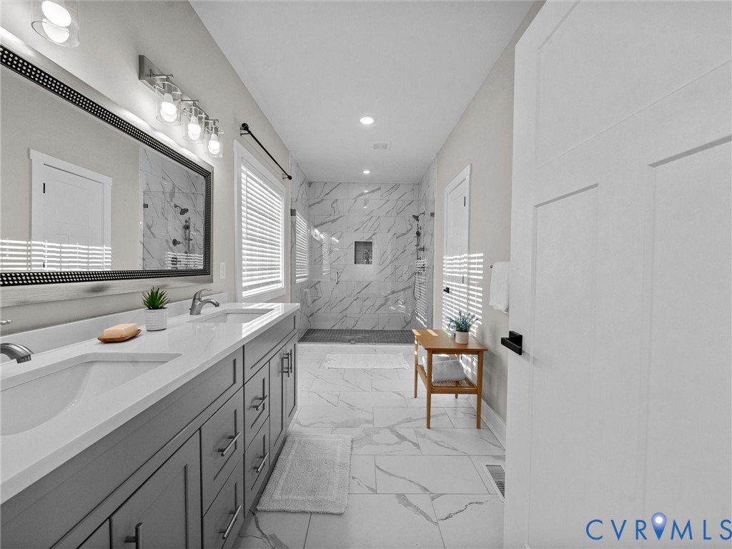 9018 Mahogany Drive Chesterfield, VA 23832 - Photo 30 of 49 Bathroom featuring double vanity, light marble fin