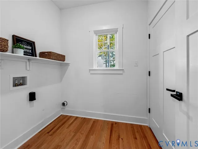 a spacious bedroom with a bed and a view of bathroom