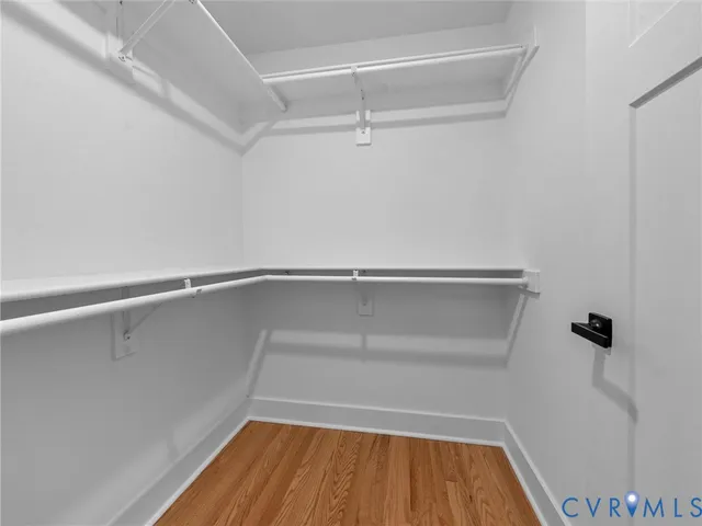 a bathroom with a double vanity sink mirror and toilet