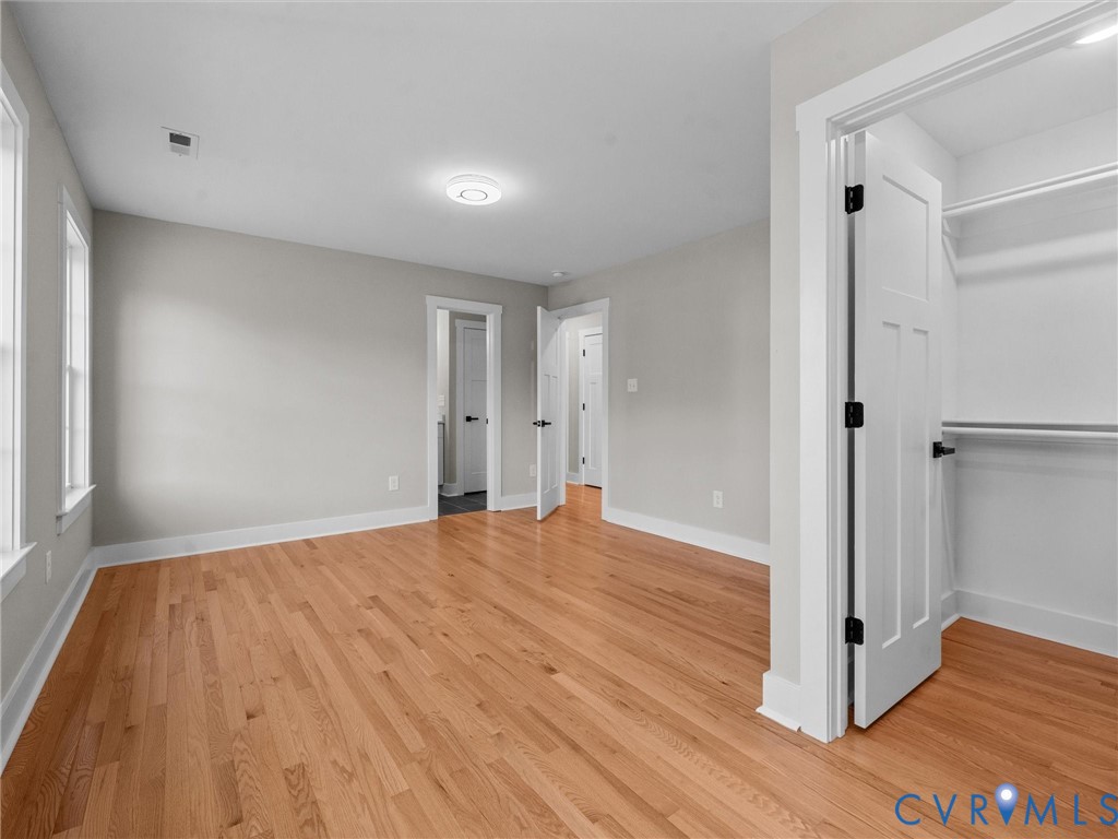 9018 Mahogany Drive Chesterfield, VA 23832 - Photo 46 of 49 Unfurnished bedroom with light wood-style floors a