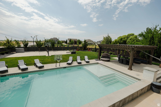924 Country Lane Farmington, UT 84025 - Photo 68 of 91 Expansive outdoor living area featuring a rectangular swimming pool with integrated steps, a large paved patio, and a substantial wooden pergola
