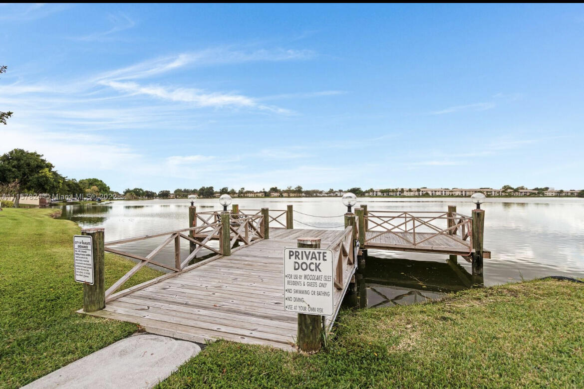 595 Banks Road Margate, FL 33063 - Photo 2 of 35 a view of a lake with couches chairs