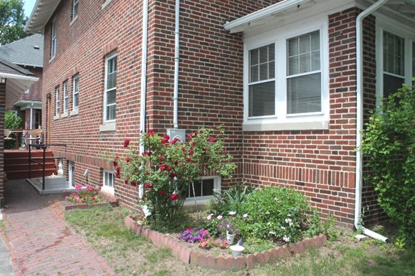 2 Raymond Street Lexington, MA 02421 - Photo 13 of 18 a view of a house with a yard and sitting area