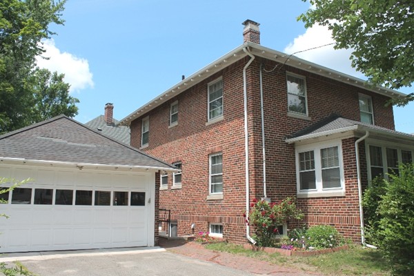 2 Raymond Street Lexington, MA 02421 - Photo 14 of 18 a front view of a house with a yard