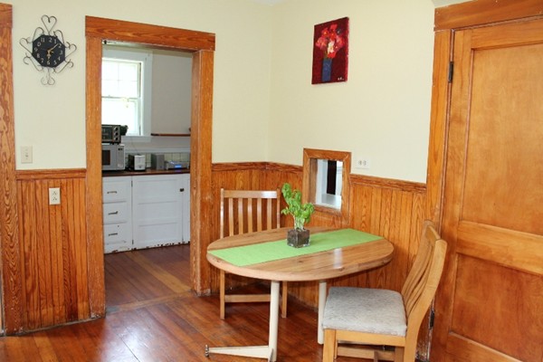 2 Raymond Street Lexington, MA 02421 - Photo 10 of 18 a view of a dining room with furniture and wooden floor
