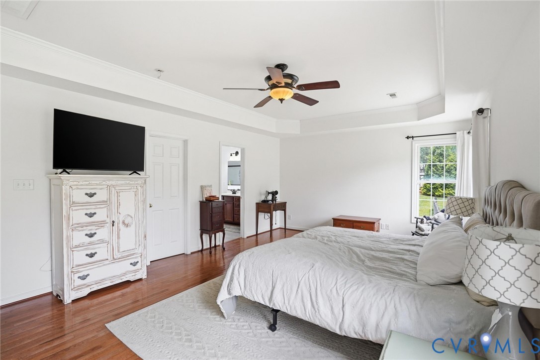 5305 Wellington Ridge Road Richmond, VA 23231 - Photo 32 of 67 Spacious bedroom featuring wood-finish flooring, a
