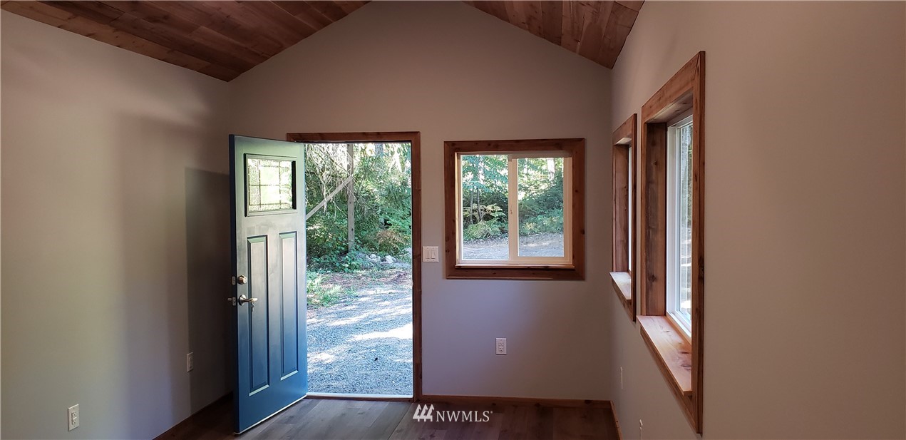 17613 Rouse Road Southwest Longbranch, WA 98351 - Photo 13 of 38 a view of a livingroom with furniture and staircase