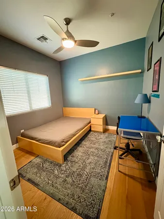 a bedroom with furniture and a window