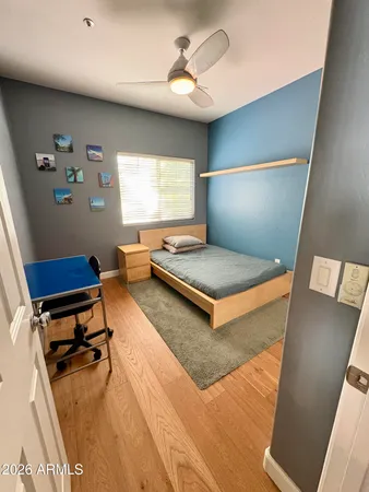 a bedroom with furniture and a window