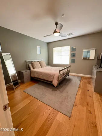a living room with a bed furniture and a window