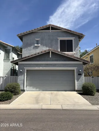 a front view of a house with garage
