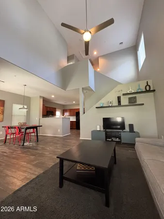 a living room with furniture a table and chairs