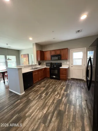 a view of kitchen with furniture and wooden floor