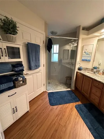a kitchen with granite countertop a sink and a stove top oven